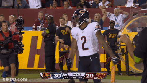 Football Player Number 10 Being Tackled GIF