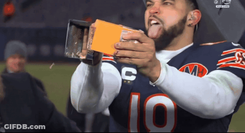 Football Player Number 10 Holding Something GIF