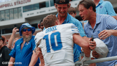 Football Player Number 10 Hugged By Fans GIF