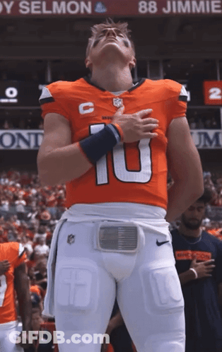 Football Player Number 10 In Front Of Jimmie Banner GIF