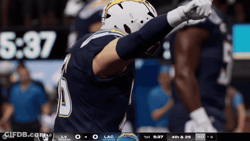 Football Player Number 10 In Front Of Scoreboard GIF