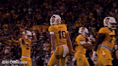 Football Player Number 10 Jersey Being Tackled GIF