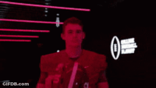 Football Player Number 10 Putting On Helmet GIF