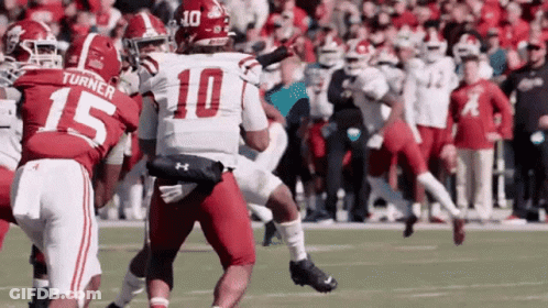Football Player Number 10 Tackled GIF