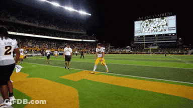Football Player Number 10 Walking Off Field GIF