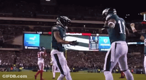 Football Player Number 11 Celebrating With Teammate GIF