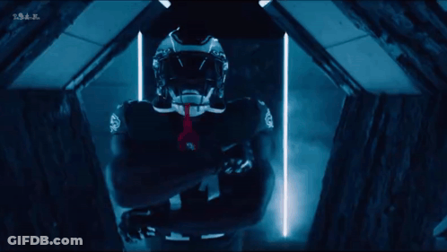 Football Player Number 11 In Dark Room GIF