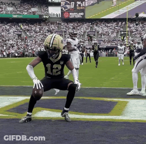 Football Player Number 12 Holding Ball GIF