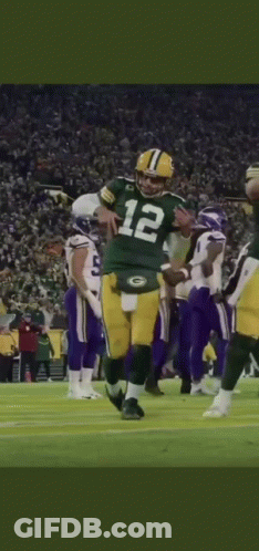 Football Player Number 12 Kneeling On Field GIF