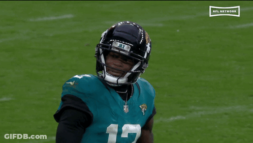 Football Player Number 12 On Field GIF
