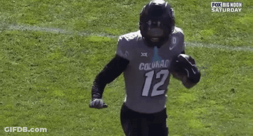 Football Player Number 12 Running On Field GIF