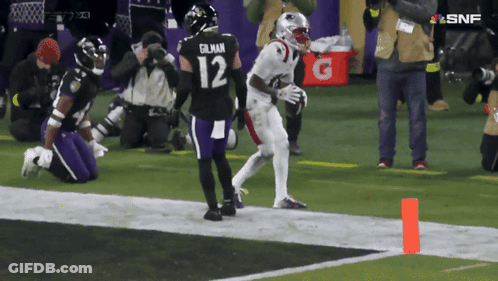 Football Player Number 12 Running On Field GIF