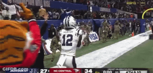 Football Player Number 12 Running On Field GIF