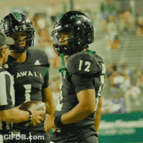 Football Player Number 12 Talking To Referee GIF