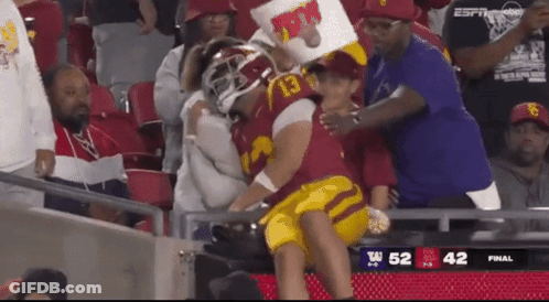 Football Player Number 13 Held By Fan GIF
