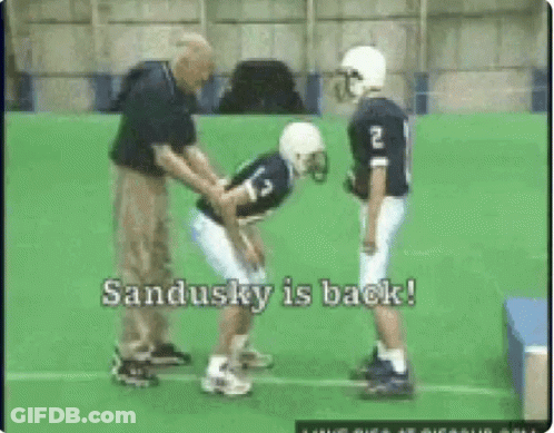 Football Player Number 13 Helped By Coach GIF