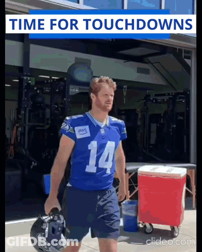 Football Player Number 14 Carrying Helmet GIF