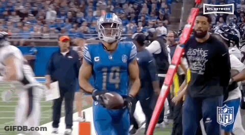 Football Player Number 14 Flexing Muscles GIF