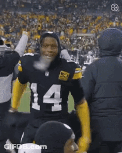 Football Player Number 14 Standing In Front Of Crowd GIF