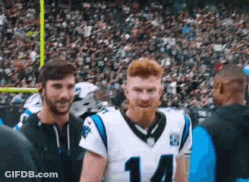 Football Player Number 14 Standing Next To Player GIF