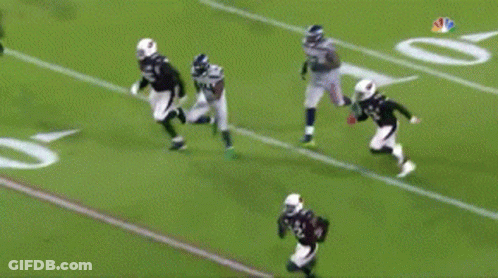 Football Player Number 14 Tackled GIF