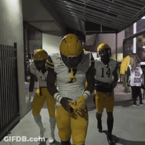 Football Player Number 14 Walking Down Hallway GIF