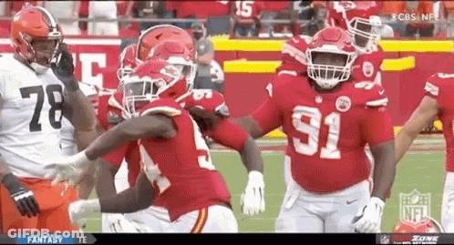 Football Player Number 15 In Front Of Flames GIF