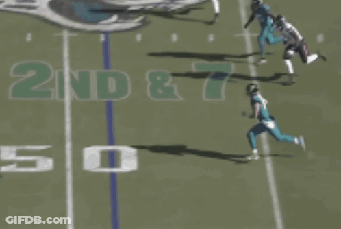 Football Player Number 15 Laying On Ground GIF