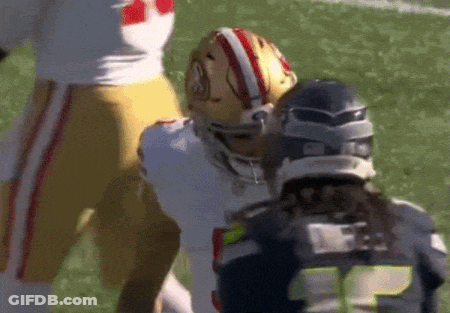 Football Player Number 15 Next To Another Player GIF