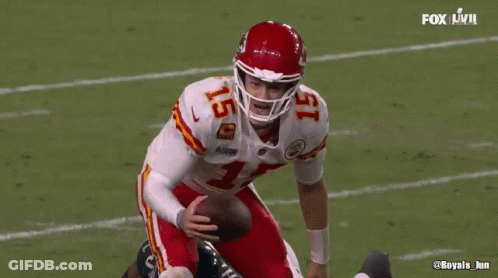 Football Player Number 15 On Helmet Standing On Field GIF