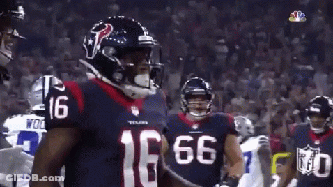 Football Player Number 16 Standing Before Crowd GIF