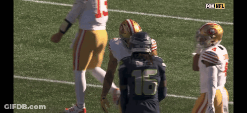 Football Player Number 16 Talking To Another GIF