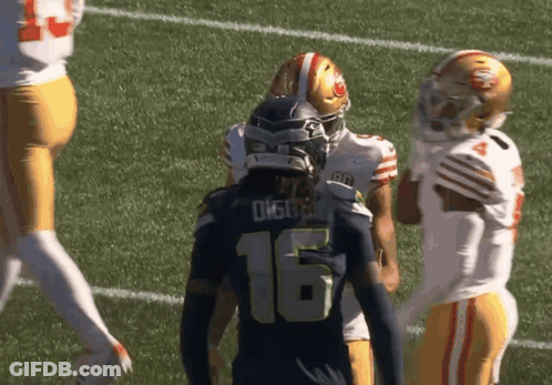 Football Player Number 16 Talking To Another GIF