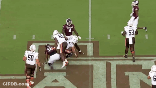 Football Player Number 18 Being Tackled GIF