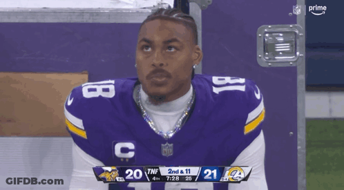 Football Player Number 18 Looking At Scoreboard GIF