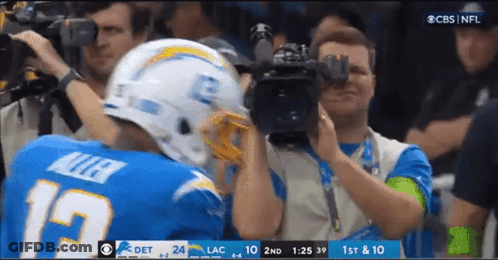 Football Player Number 19 Being Photographed GIF