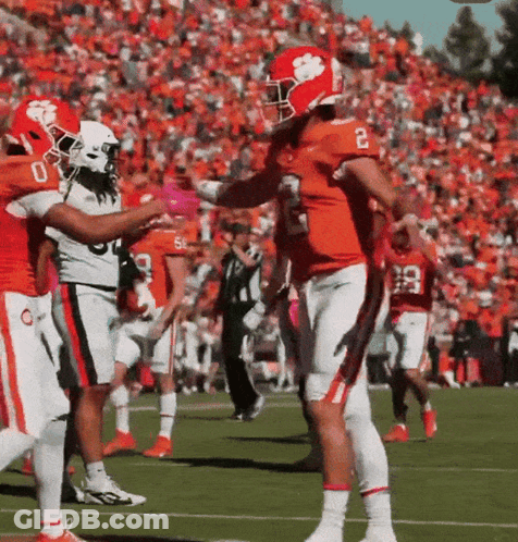 Football Player Number 2 Being Hugged By Another Player GIF
