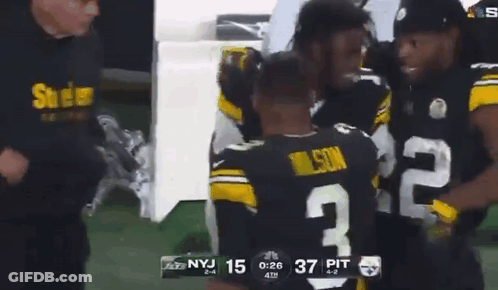 Football Player Number 2 Hugging Another Player GIF