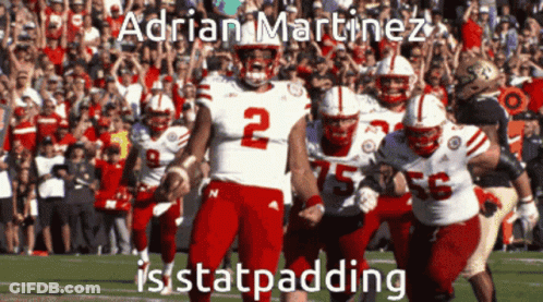 Football Player Number 2 Running With Teammates GIF