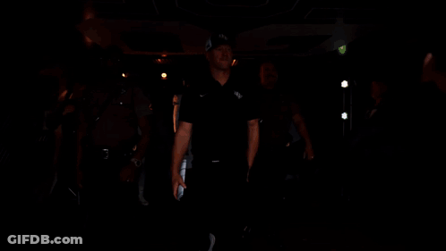Football Player Number 2 Walking Into Tunnel GIF
