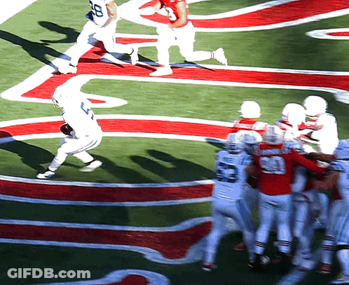 Football Player Number 20 Being Tackled GIF