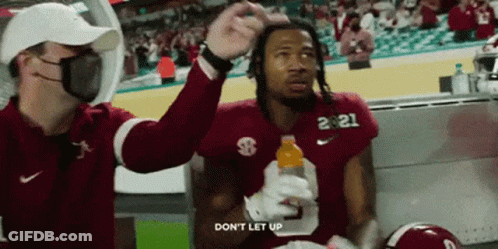 Football Player Number 21 Holding Gatorade Bottle GIF