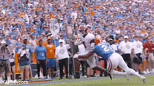 Football Player Number 22 Jumping To Catch Ball GIF