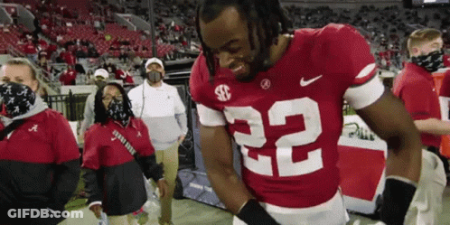 Football Player Number 22 Standing On Field GIF