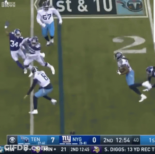 Football Player Number 22 Tackled GIF
