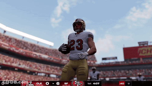 Football Player Number 23 Holding Football GIF
