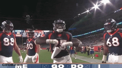 Football Player Number 25 Dancing With Teammates GIF