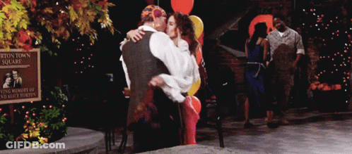 Football Player Number 28 Surrounded By Fans GIF