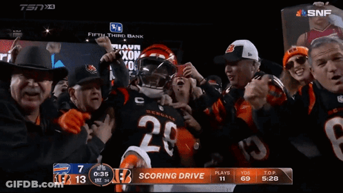 Football Player Number 28 Surrounded By Fans GIF