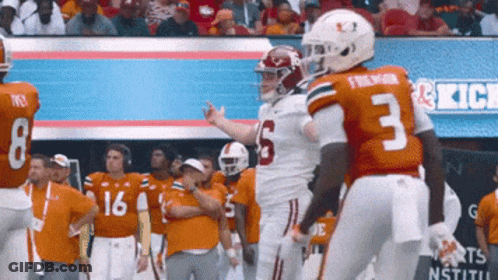 Football Player Number 3 Talking To Another Player GIF